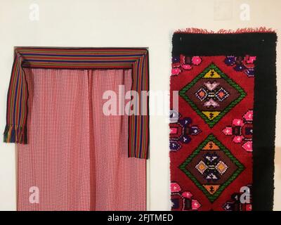 Traditional Serbian carpet and curtains Stock Photo