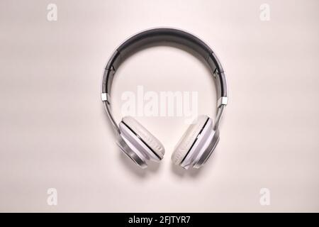 Close-up view of modern metallic headphones on white background Stock Photo