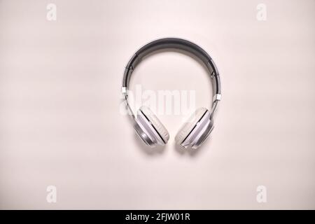 Close-up view of modern metallic headphones on white background Stock Photo