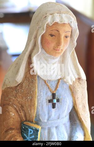 France, Tarn, Dourgne, entrance to the Benedictine Abbey of Sainte Scholastique (located on the Way of St. James), statue in plaster and resin of Saint Scholastica hand painted by Sister Mercedes Stock Photo