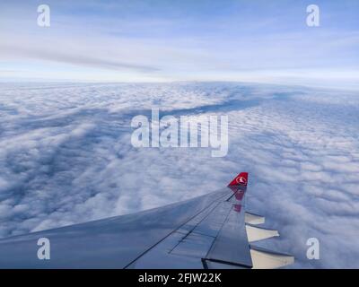 ISTANBUL, TURKEY - Mar 02, 2021: Flying above the clouds on Turkish Airlines Stock Photo