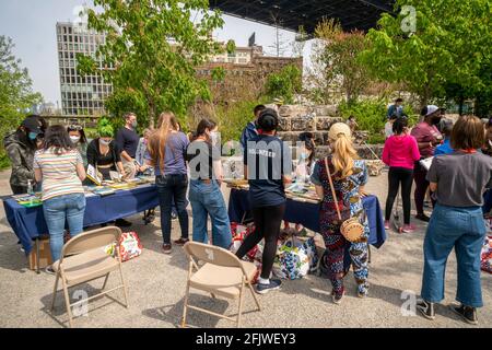 New York, USA. 24th Apr, 2021. Book lovers flock to the Brooklyn Bridge Park in Brooklyn in New York on Saturday, April 24, 2021 to browse free books at a childrenÕs book fair. (Photo by Richard B. Levine) Credit: Sipa USA/Alamy Live News Stock Photo