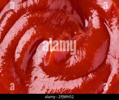 Ketchup or tomato sauce puddle. Close-up. Stock Photo