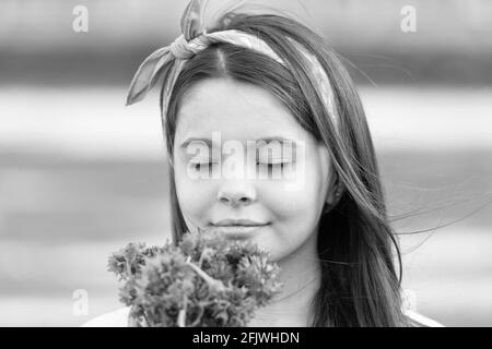 Little girl cornflowers bouquet holiday greetings, fresh fragrance concept Stock Photo