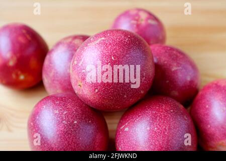 Pile of Fresh Ripe Passion Fruits on Wooden Background Stock Photo