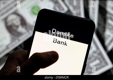 China. 23rd Apr, 2021. In this photo illustration the Danish Danske Bank logo seen displayed on a smartphone with USD (United States dollar) currency in the background. (Photo by Budrul Chukrut/SOPA Images/Sipa USA) Credit: Sipa USA/Alamy Live News Stock Photo