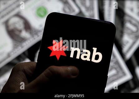 China. 23rd Apr, 2021. In this photo illustration the Australian banking and financial services company National Australia Bank NAB logo seen displayed on a smartphone with USD (United States dollar) currency in the background. (Photo by Budrul Chukrut/SOPA Images/Sipa USA) Credit: Sipa USA/Alamy Live News Stock Photo