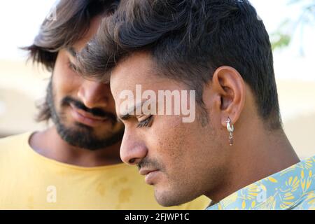 Portrait of two young Indian males in the park Stock Photo