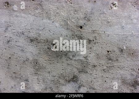 Concrete wall after rain. Wet concrete texture. Rough concrete. Stock Photo