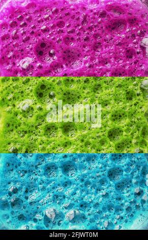 Multi-colored foam of three colors, pink, green and blue in a row. Conceptual color background Stock Photo