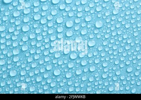 Water drops texture on blue background. Abstract background with pure droplets pattern. Stock Photo