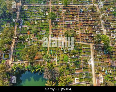 The Aerial shot indicates the aerial view of a Muslim Graveyard situated at Barisal in Bangladesh which is the largest Graveyard in the country where thousands of Muslim worshipers pray for their lost-one after their Prayer at Mosque. Stock Photo