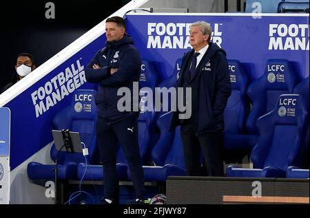 Crystal Palace manager Roy Hodgson (right) and first team coach Dave Reddington look on during the Premier League match at the King Power Stadium, Leicester. Picture date: Monday April 26, 2021. Stock Photo