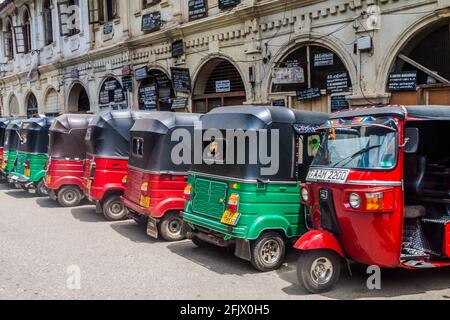 KANDY, SRI LANKA - JULY 19, 2016: Row of parked tuk tuks at Deva Veediya street in Kandy, Sri Lanka Stock Photo