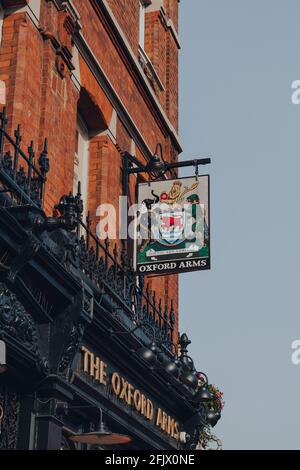 London, UK - August 12, 2020: Sign and emblem on the facade of The Oxford Arms pub on empty High Street in Camden Town, London, an area famed for its Stock Photo