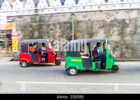 KANDY, SRI LANKA - JULY 19, 2016: Tuk tuks on a street of Kandy. Stock Photo