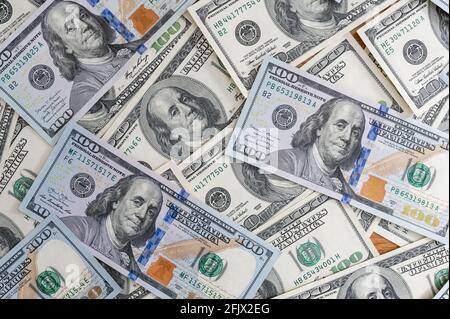 Cash money in a large pile as a finance background. Paper money close up. Top view. Stock Photo