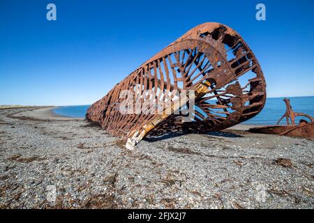 Wreckages, abandoned rusty stranded boat on San Gregorio beach in the south of Chile at the strait of Magellan Stock Photo