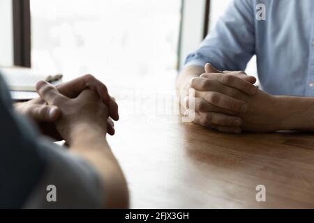 Close up of male colleagues have negotiation in office Stock Photo