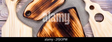 Handmade chopping boards. Lots of cutting boards. View from above. Stock Photo