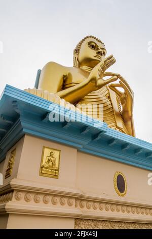 Buddhaa statue at the top of Golden Temple in Dambulla, Sri Lanka Stock Photo