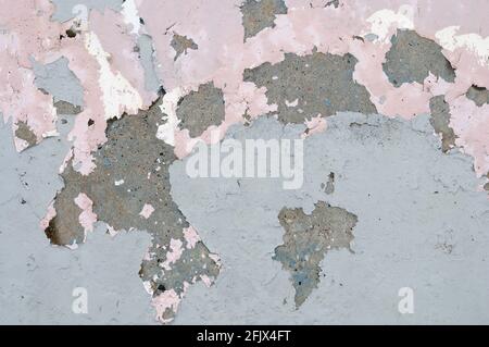 Paint peeling off concrete wall. Suitable as background or texture. Stock Photo