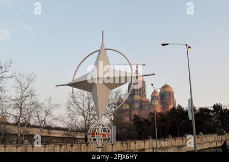 BUCHAREST, ROMANIA - 24  FEBRUARY 2021: The NATO compass star in Bucharest in front of the Catedrala Mântuirii Neamului (Cathedral of the People's Sal Stock Photo