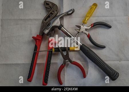 Top view of a set of DIY tools (pliers, hammer, wire cutters, and screwdrivers) Stock Photo
