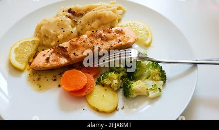 Sautéed salmon with vegetables Stock Photo