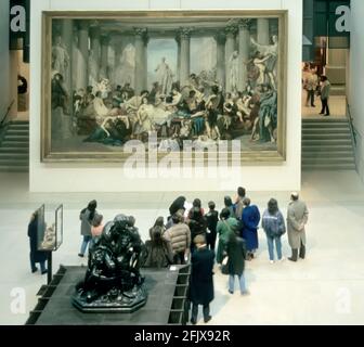 People viewing Thomas Couture's Les romains de la decadence (Romans during the Decadence) Musee d'Orsay, Paris, France Stock Photo