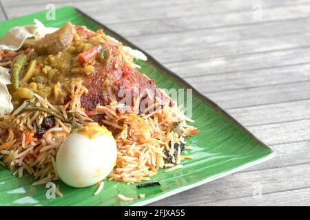 Chicken Briyani rice on table. An Indian cuisine. Side view. Copy space. Stock Photo