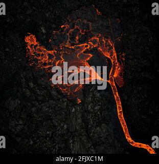 Flow of lava on rocky ground Stock Photo