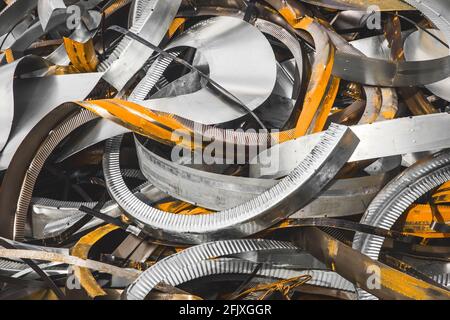 Metal waste with rust traces, steel trash pile background close up. Stock Photo