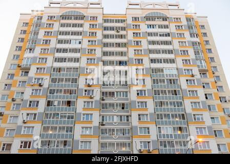 Ugly facade of a multi-storey building. Panel house in new Moscow. The facade is made of tiles. Stock Photo