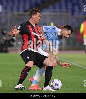 Rome, Italy. 26th Apr, 2021. Lazio's Francesco Acerbi (R) vies with AC Milan's Mario Mandzukic during a Serie A football match in Rome, Italy, April 26, 2021. Credit: Augusto Casasoli/Xinhua/Alamy Live News Stock Photo