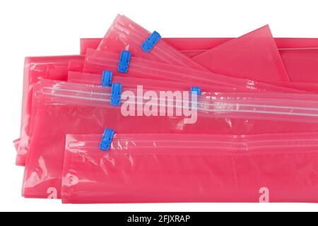 Closeup pink plastic zip lock bag with blue sealing to pack store cloths and resealable isolated on white background Stock Photo