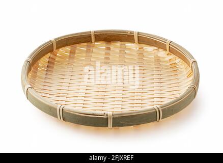 Bamboo basket placed on a white background.Bamboo basket plate for Zaru Soba Stock Photo