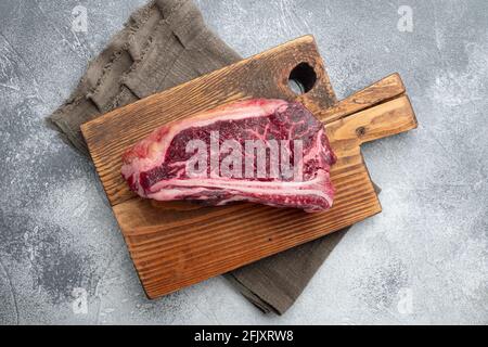 Raw fresh meat dry aged Club Steak set, on gray stone background, top view flat lay Stock Photo