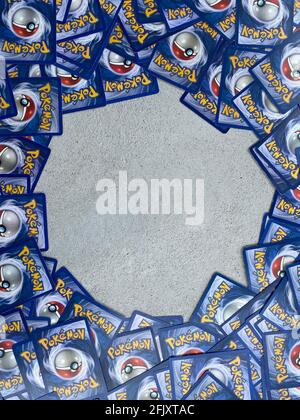 Pokemon card laying in a circle with an empty center. Pokemon trading cards. Stock Photo