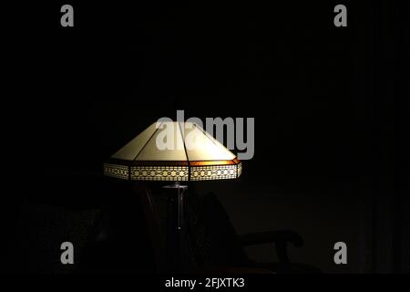 Detailed Vintage style night lamp in a dark room. Stone Filigree. Copy space Stock Photo