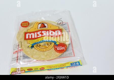 Mission Yellow Corn Tortillas flat lay on white background with copy space. Good source of fiber. Stock Photo