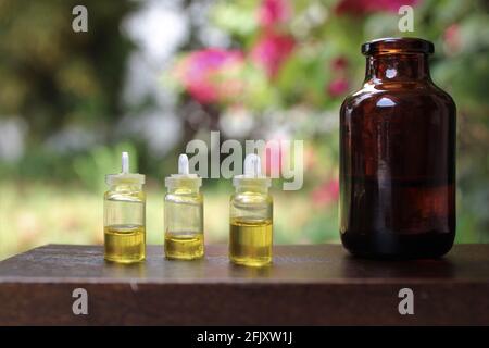 Bottles of essential oils and tinctures with copy space or CBD oil concept. Hemp oil Stock Photo