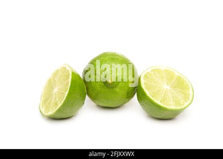 Fresh and sliced lime isolated on white background Stock Photo