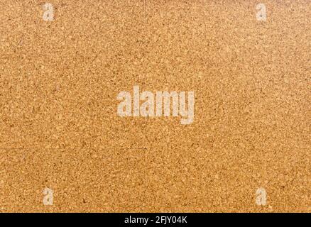 Brown and yellow color of cork board. Textured wooden background. Cork board with copy space. Notice board or bulletin board image. Stock Photo