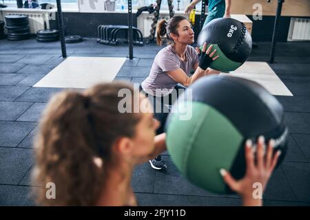 Two young fit ladies working out together Stock Photo