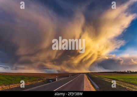 Mammatus clouds at sunset, dramatic storm clouds Stock Photo