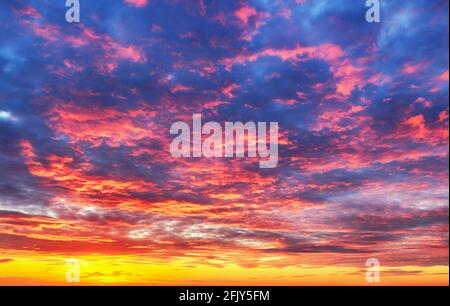 Sky at color sunset with orange red clouds Stock Photo