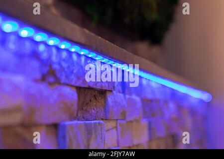 RGB LED stripe on a wall in the living area Stock Photo