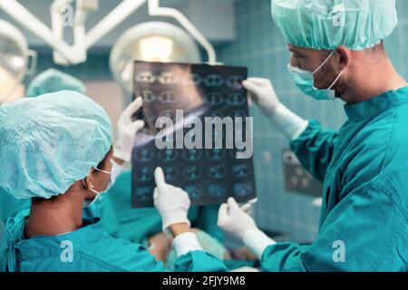 Portrait of intellectual healthcare professionals with at x-ray radiographic image, ct scan, mri Stock Photo