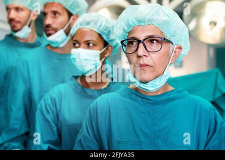 Exhausted surgeons at the emergency room as a sign of stress and overwork Stock Photo